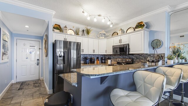 10519 Front Beach Rd Unit 1904B, Panama City Beach, FL 32407 - kitchen featuring stainless steel range with electric stovetop, black fridge, dark stone counters, a peninsula, and crown molding