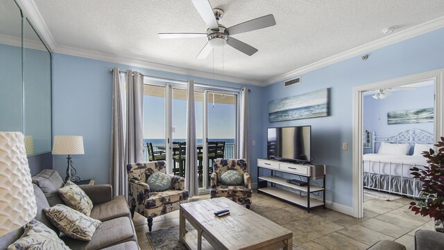 10519 Front Beach Rd Unit 1904B, Panama City Beach, FL 32407 - living room with visible vents, a textured ceiling, ceiling fan, and ornamental molding