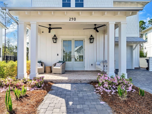 290 White Cottage Rd, Santa Rosa Beach, FL 32459 - entrance to property featuring french doors, ceiling fan, and board and batten siding