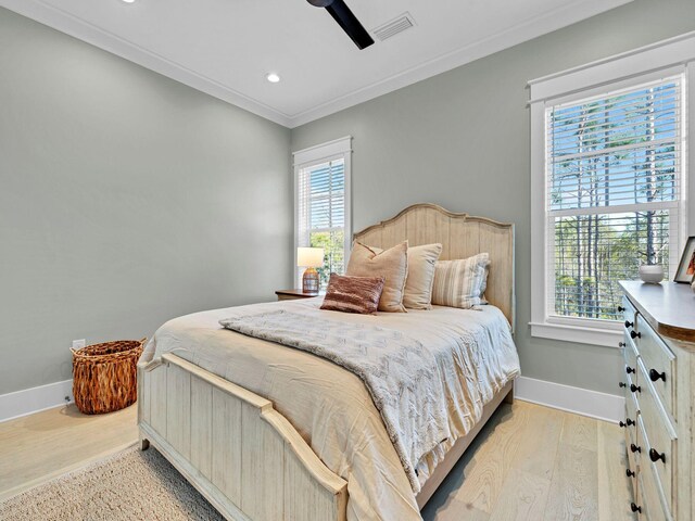 290 White Cottage Rd, Santa Rosa Beach, FL 32459 - bedroom with multiple windows, baseboards, and light wood-style floors