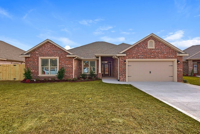 single story home with driveway, a front yard, an attached garage, and brick siding