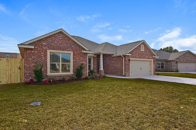 view of front of home with concrete driveway, fence, an attached garage, a front yard, and brick siding