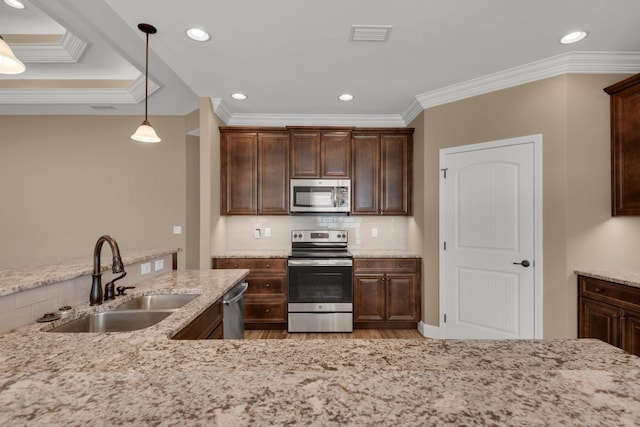 kitchen featuring a sink, dark brown cabinets, crown molding, and appliances with stainless steel finishes