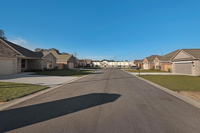 view of road featuring street lights and a residential view