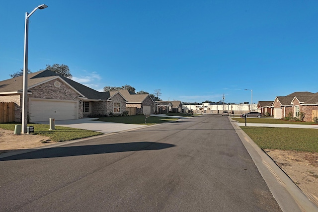 view of street with a residential view and street lighting