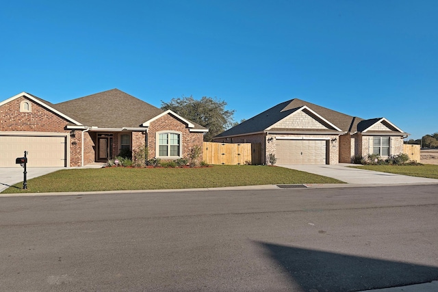 view of front of home featuring an attached garage, fence, concrete driveway, and brick siding