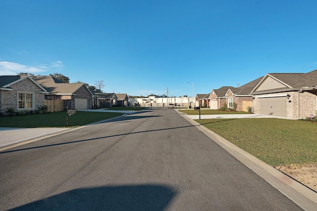 view of road featuring a residential view and street lights