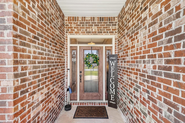 entrance to property with brick siding