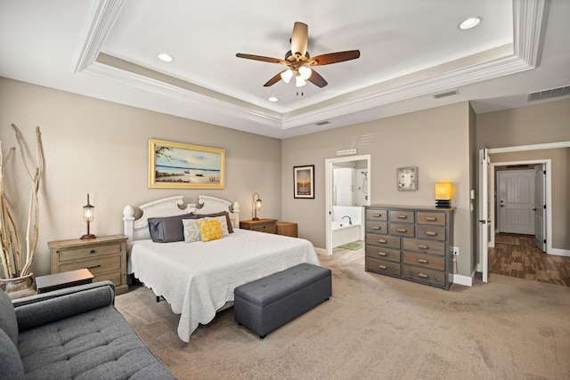 bedroom featuring a raised ceiling, baseboards, and visible vents
