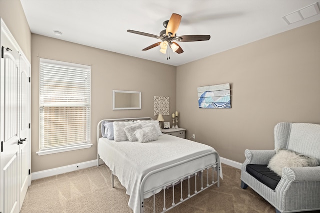 bedroom with carpet, baseboards, ceiling fan, and visible vents