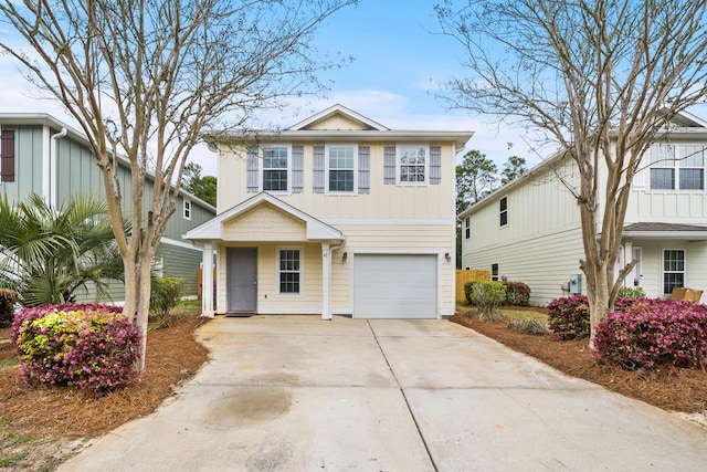 view of front of property featuring an attached garage and concrete driveway