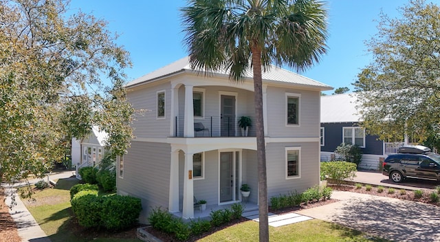13 Taylor Krenkel Ct, Santa Rosa Beach, FL 32459 - view of front of house with a balcony and metal roof