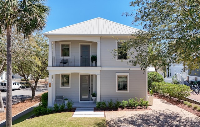 13 Taylor Krenkel Ct, Santa Rosa Beach, FL 32459 - view of front of home featuring covered porch, a balcony, and metal roof