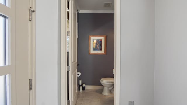 13 Taylor Krenkel Ct, Santa Rosa Beach, FL 32459 - bathroom with visible vents, baseboards, ornamental molding, toilet, and tile patterned flooring
