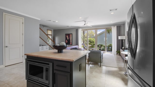 13 Taylor Krenkel Ct, Santa Rosa Beach, FL 32459 - kitchen with light countertops, ornamental molding, stainless steel appliances, a kitchen island, and visible vents