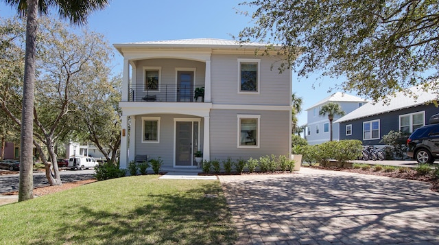 13 Taylor Krenkel Ct, Santa Rosa Beach, FL 32459 - view of front of property featuring a balcony, metal roof, and a front yard