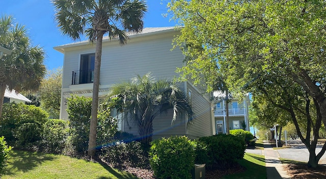13 Taylor Krenkel Ct, Santa Rosa Beach, FL 32459 - view of side of property featuring a balcony and metal roof