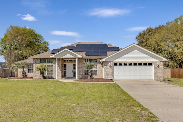 view of front of home featuring concrete driveway, fence, brick siding, a front lawn, and a garage