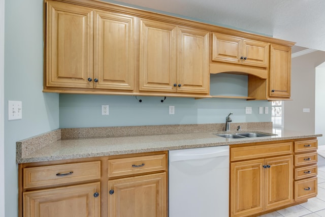 kitchen featuring a sink, light stone countertops, dishwasher, and light brown cabinets