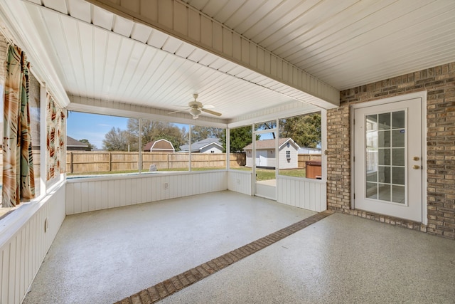 view of patio with ceiling fan and fence