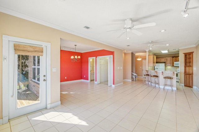 unfurnished living room with crown molding, light tile patterned floors, baseboards, and visible vents