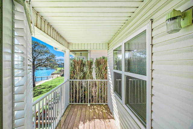 wooden deck with a water view