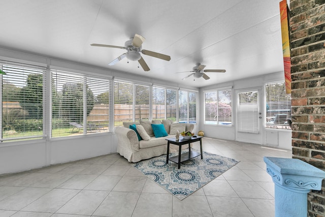 sunroom / solarium with plenty of natural light, outdoor lounge area, and ceiling fan