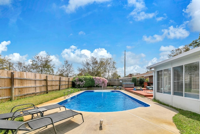 view of swimming pool featuring a patio, a fenced in pool, and a fenced backyard