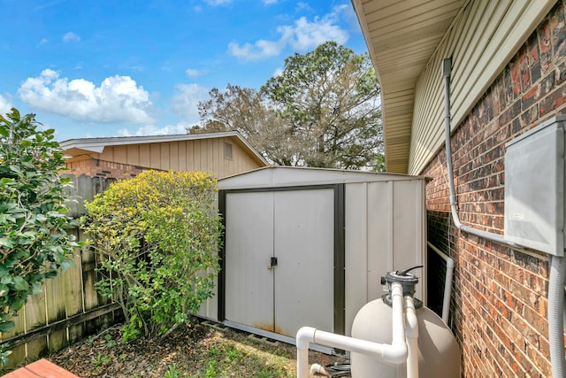 view of shed featuring fence
