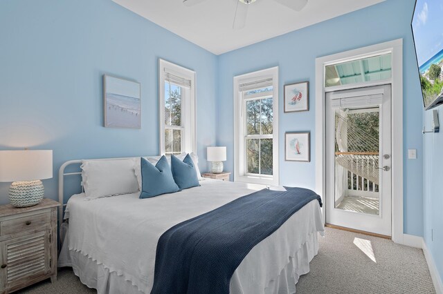 68 N Ryan St, Santa Rosa Beach, FL 32459 - carpeted bedroom featuring baseboards, access to exterior, and ceiling fan