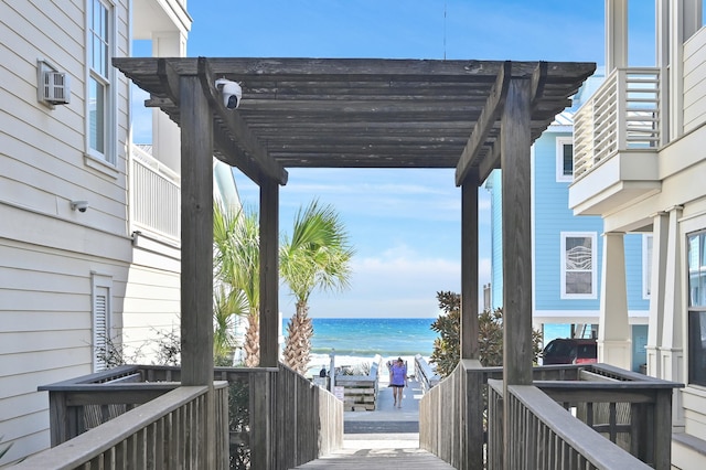 68 N Ryan St, Santa Rosa Beach, FL 32459 - wooden terrace featuring a pergola, a water view, and a beach view