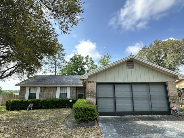 ranch-style home featuring fence and brick siding