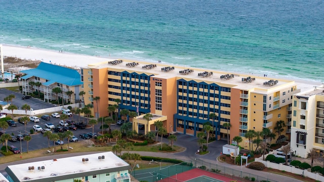 bird's eye view with a water view and a beach view