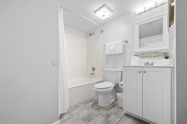 bathroom with vanity, shower / tub combo, toilet, visible vents, and wood tiled floor