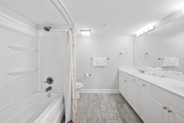 full bath with shower / bath combination with curtain, toilet, a sink, wood finished floors, and double vanity