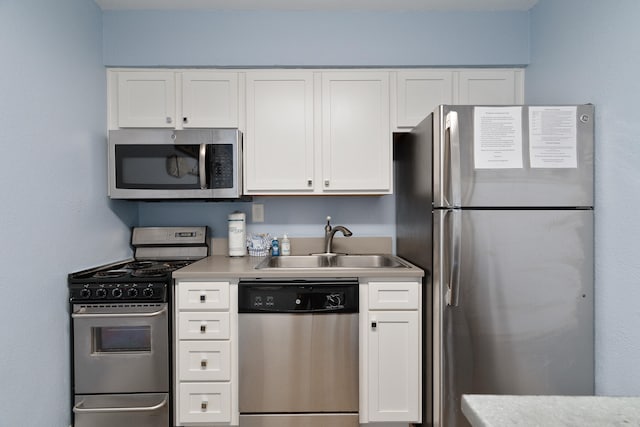 790 Santa Rosa Blvd Unit 403, Fort Walton Beach, FL 32548 - kitchen with white cabinetry, a sink, and appliances with stainless steel finishes