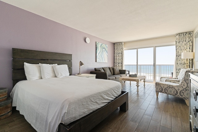 790 Santa Rosa Blvd Unit 403, Fort Walton Beach, FL 32548 - bedroom with a water view, dark wood-type flooring, and access to outside