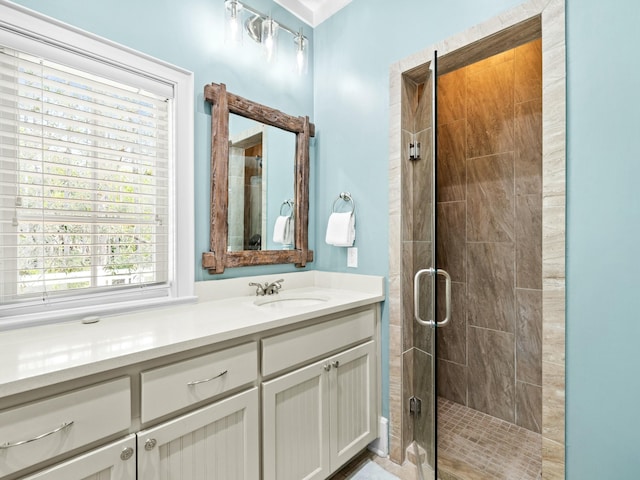 full bathroom featuring a shower stall and vanity