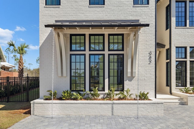 342 Windsong Dr, Inlet Beach, FL 32461 - view of exterior entry with brick siding and fence