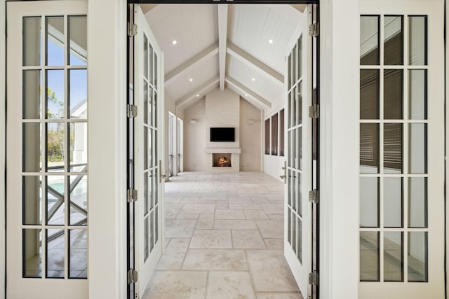 342 Windsong Dr, Inlet Beach, FL 32461 - corridor featuring french doors, stone tile floors, vaulted ceiling with beams, and recessed lighting