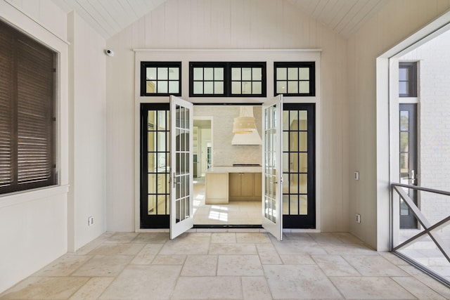 342 Windsong Dr, Inlet Beach, FL 32461 - entryway with vaulted ceiling, french doors, and stone tile flooring