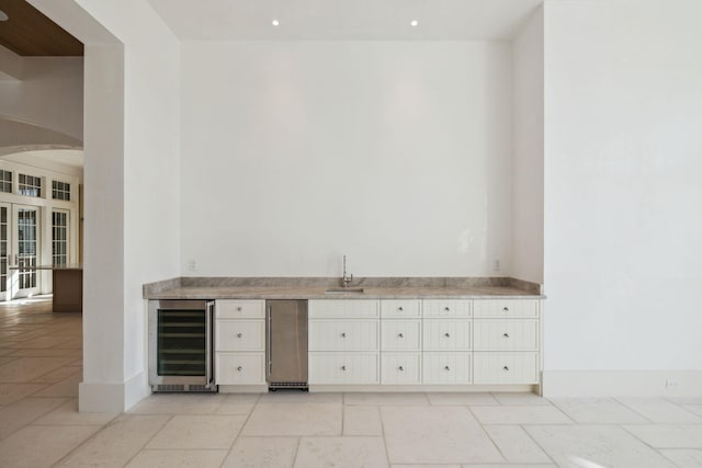 342 Windsong Dr, Inlet Beach, FL 32461 - bar with french doors, a sink, bar, beverage cooler, and arched walkways
