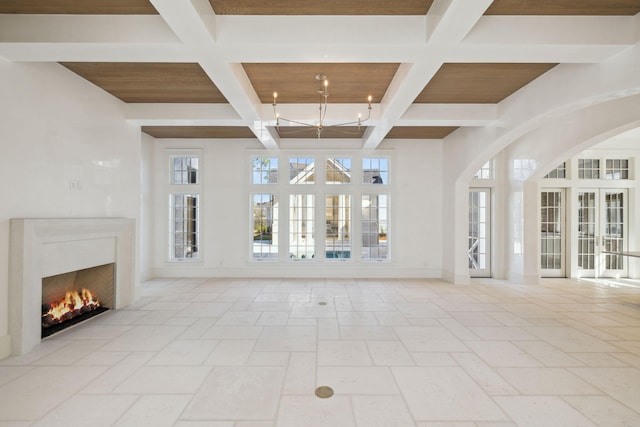 342 Windsong Dr, Inlet Beach, FL 32461 - unfurnished living room with coffered ceiling, a lit fireplace, beamed ceiling, and baseboards