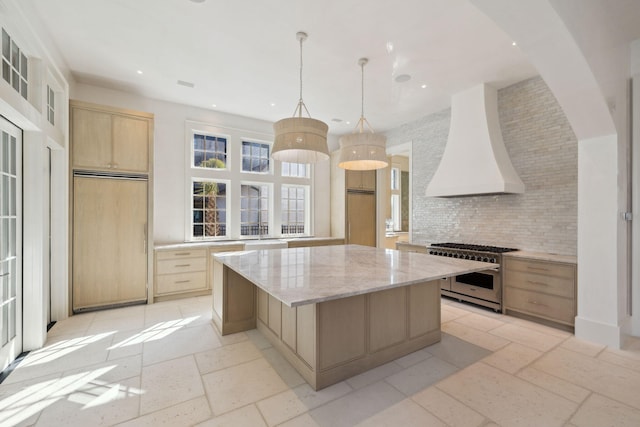 342 Windsong Dr, Inlet Beach, FL 32461 - kitchen featuring decorative backsplash, custom exhaust hood, high end appliances, stone tile flooring, and light brown cabinets