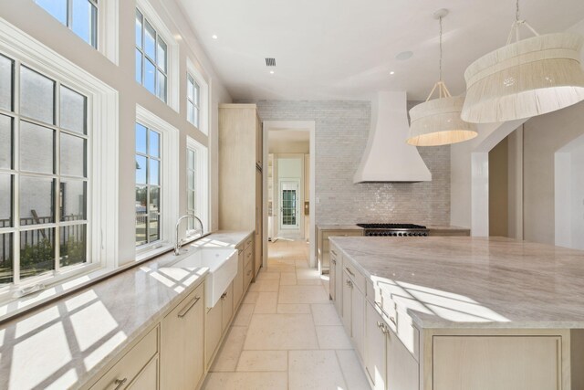 342 Windsong Dr, Inlet Beach, FL 32461 - kitchen featuring a sink, light brown cabinets, stone tile flooring, and custom exhaust hood