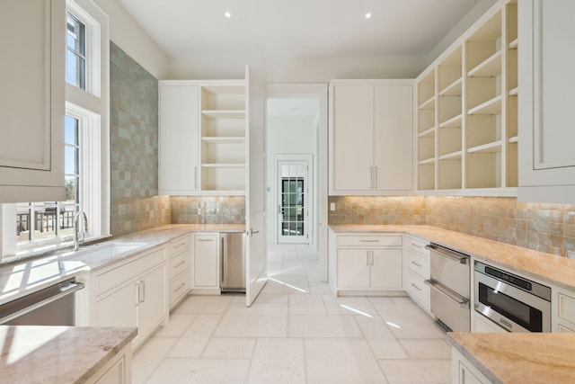 342 Windsong Dr, Inlet Beach, FL 32461 - kitchen featuring a warming drawer, tasteful backsplash, open shelves, a sink, and appliances with stainless steel finishes