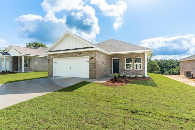 6119 Tansey St, Crestview, FL 32539 - ranch-style home with cooling unit, an attached garage, brick siding, concrete driveway, and a front yard