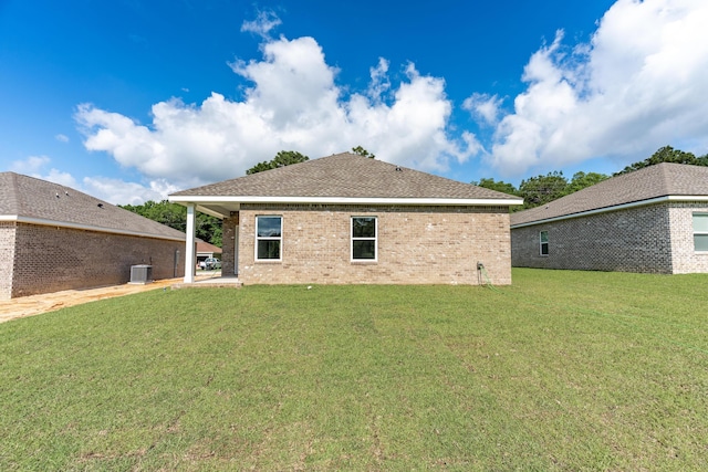 6119 Tansey St, Crestview, FL 32539 - back of property featuring a yard, central AC, and brick siding
