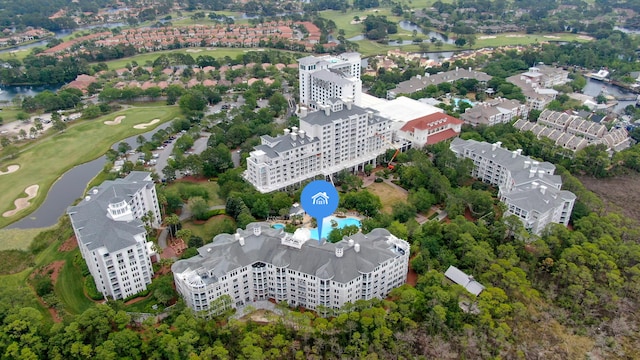 bird's eye view featuring a water view and golf course view