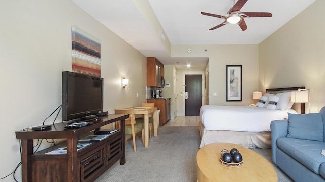 bedroom featuring light tile patterned flooring and light carpet